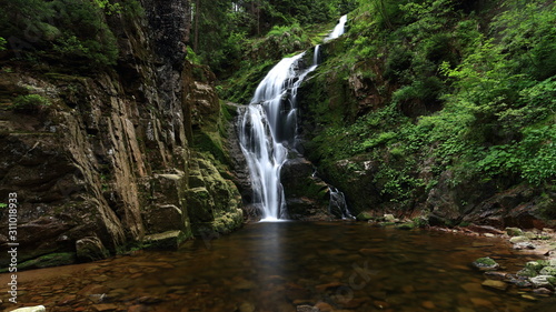 Waterfall in green forest