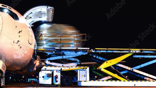 pan aircraft loading cargo timelapse in night