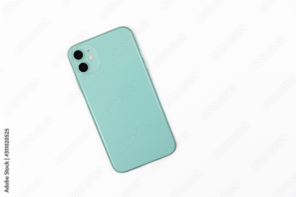 Smart phone light green color with two cameras isolated on a white background top view Smart phone light green color with two cameras isolated on a white background top view