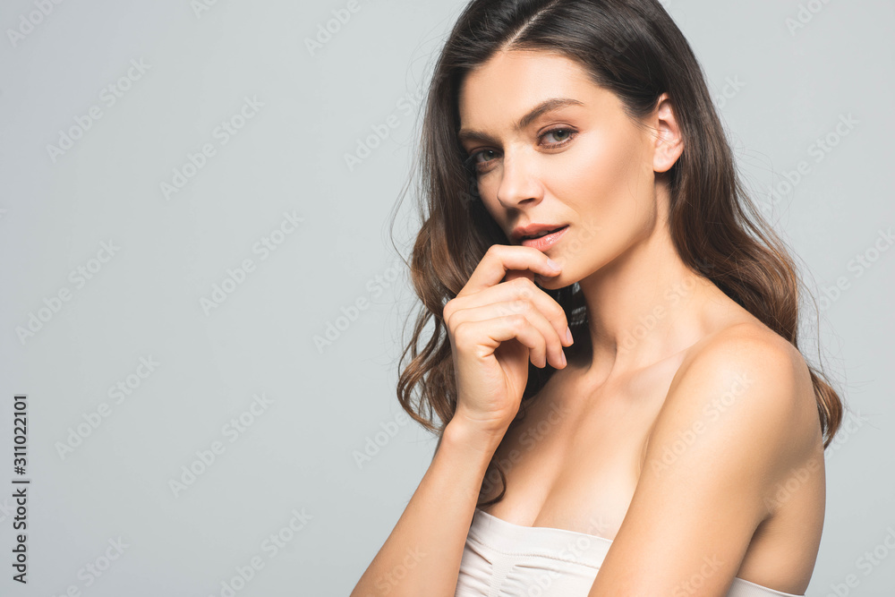 portrait of attractive tender brunette woman, isolated on grey portrait of attractive tender brunette woman, isolated on grey