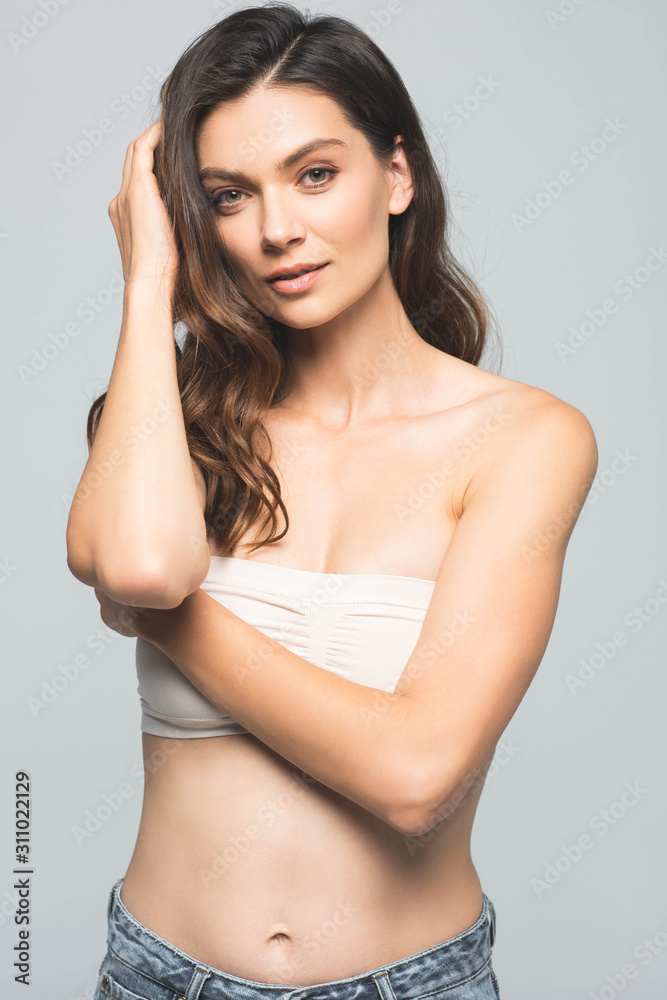 portrait of attractive brunette woman, isolated on grey portrait of attractive brunette woman, isolated on grey