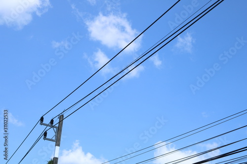  The sky at noon with the wires leading the eyes