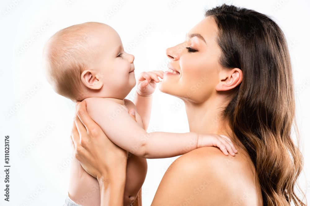 portrait of happy naked mother looking at baby, isolated on white portrait of happy naked mother looking at baby, isolated on white