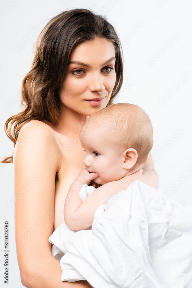 portrait of happy naked mother hugging baby boy, isolated on white portrait of happy naked mother hugging baby boy, isolated on white