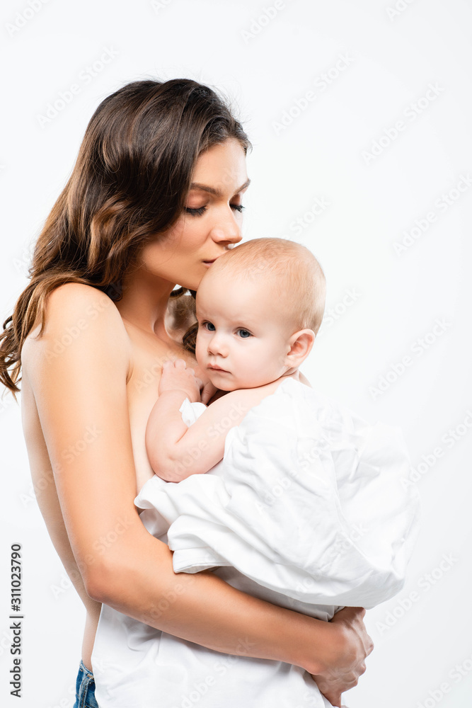 portrait of naked mummy kissing baby boy, isolated on white portrait of naked mummy kissing baby boy, isolated on white