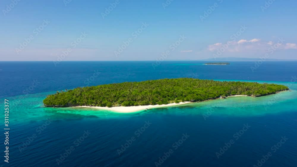 Atoll with a beautiful island, aerial view. White sand beach and blue sea. Mahaba Island, Philippines. Summer and travel vacation concept. Atoll with a beautiful island, aerial view. White sand beach and blue sea. Mahaba Island, Philippines. Summer and travel vacation concept.