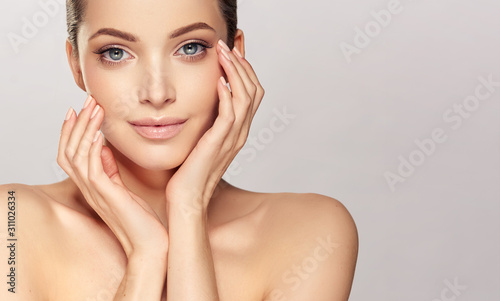 Beautiful young woman with clean fresh skin on face . Girl facial  treatment ...