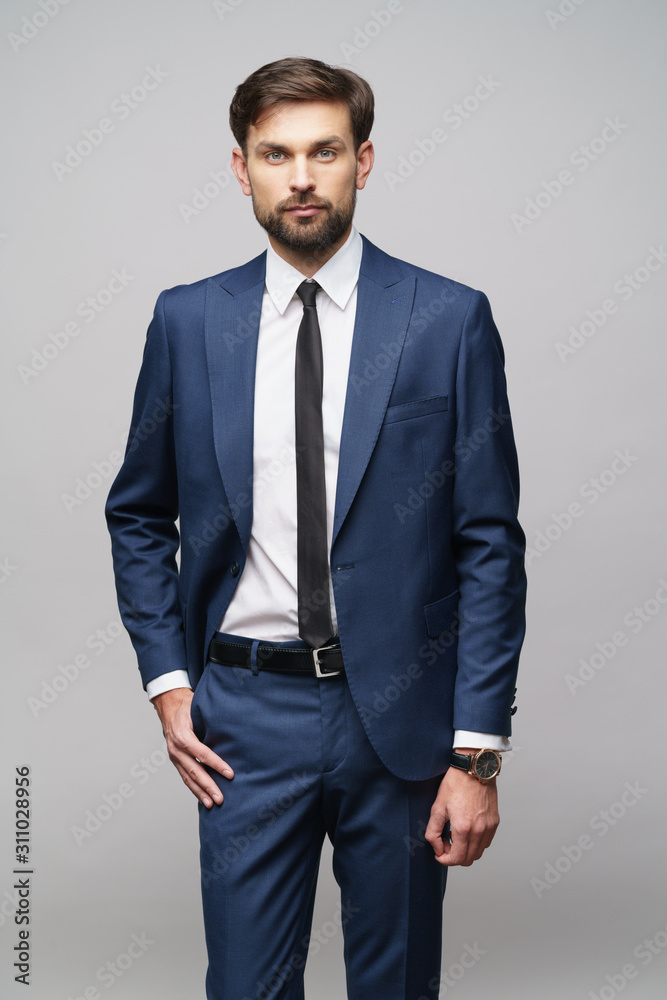 Fototapeta premium studio photo of young handsome businessman wearing suit