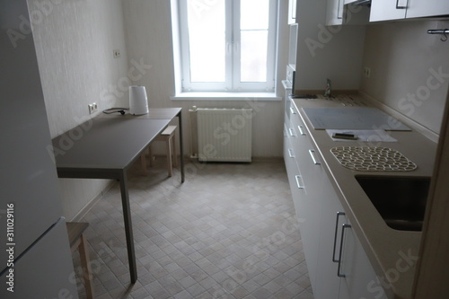 Modern interior of a kitchen in white in minimalist style