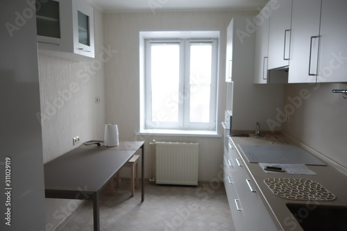 Interior of a modern kitchen in white in minimalist style