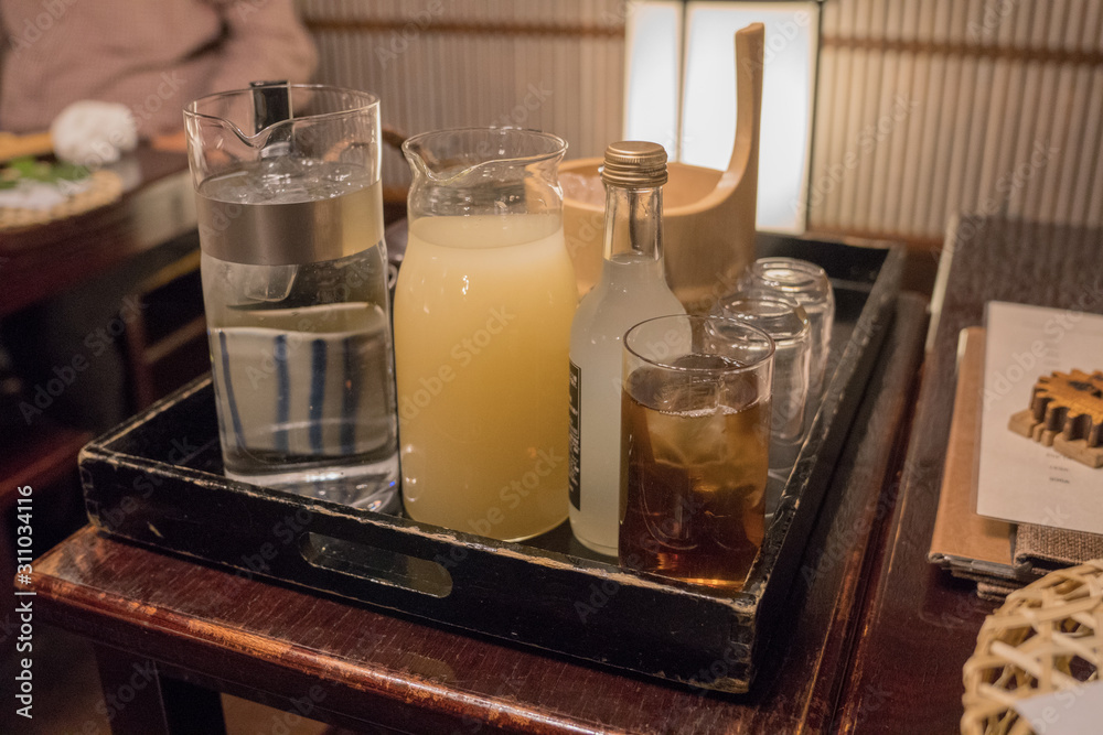 bar cart with a selection of drinks, juices and water bar cart with a selection of drinks, juices and water