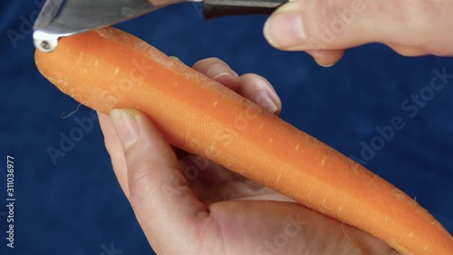 Peeling a Carrot With a Vegetable Peeler