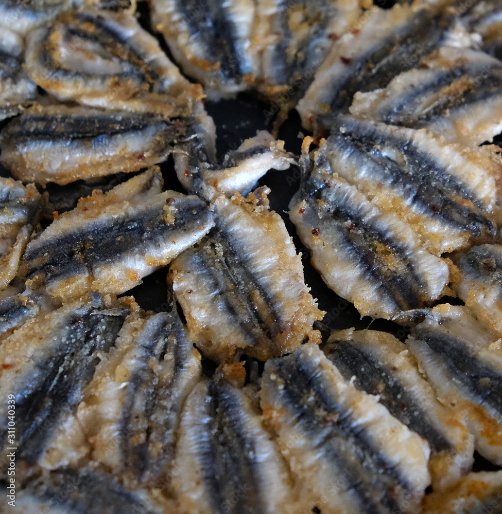 anchovy fish cooked on a stove, cooking anchovy in a pan, anchovy in a Turkish style pan, anchovy fish cooked on a stove, cooking anchovy in a pan, anchovy in a Turkish style pan,