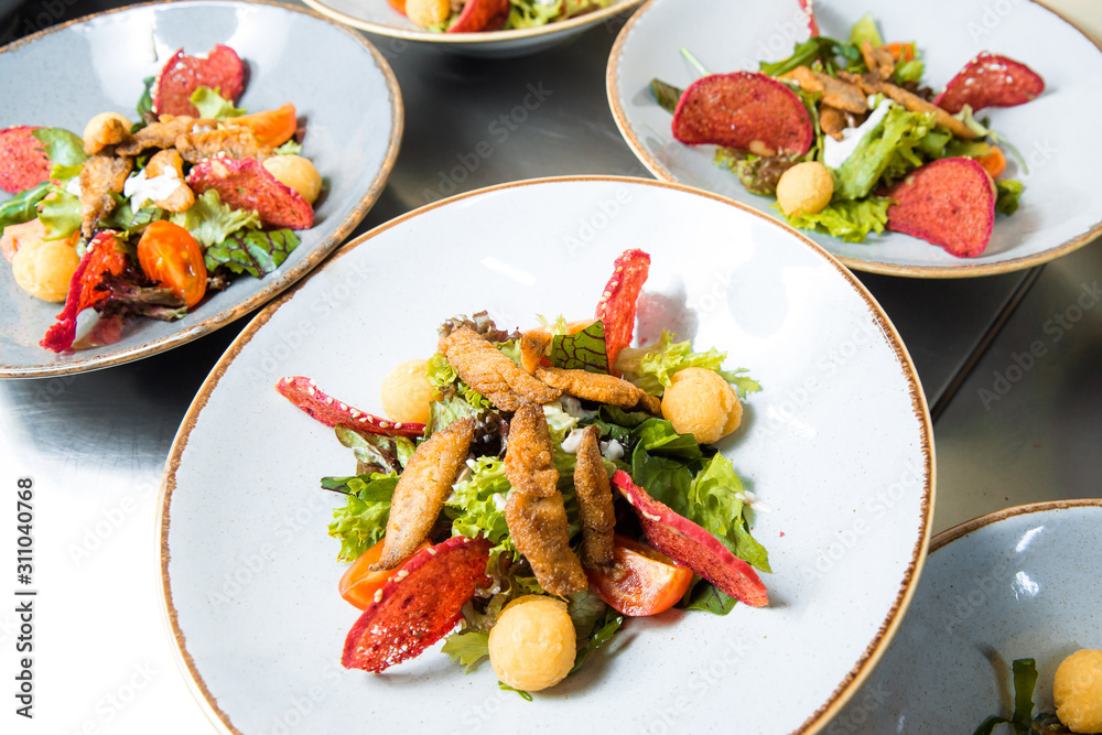 Salad with fried fish fillet red mullet. Salad with fried fish fillet red mullet.