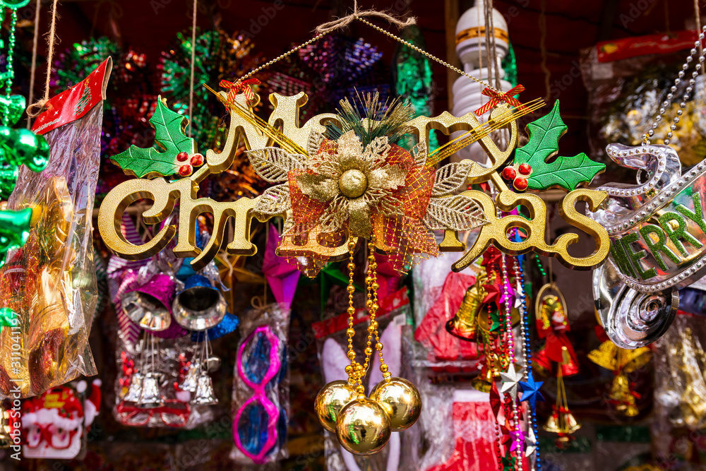 Φωτογραφία Merry Christmas written board, Christmas ball and Christmas bells for Holiday home decoration , Happy new year 2020