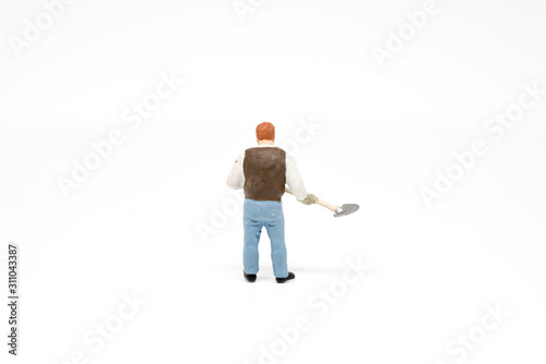 Miniature people cleaning up concept on background with a space for text