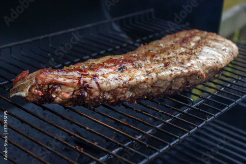 grilled meat ribs on a grill outdoors barbecue BBQ
