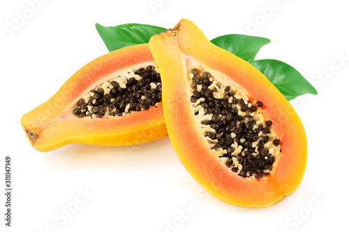 half of ripe papaya with leaf isolated on a white background