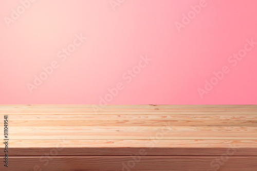 Empty wooden table over pink background. Valentines day concept celebration.