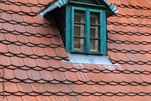red tile roof with blue windows