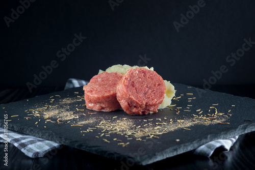 cotechino and mashed potatoes in the foreground