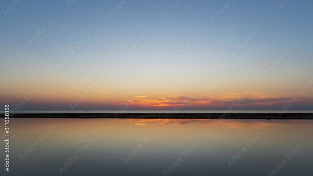 Time lapse video Amazing stunning Colorful sky with sunset view in the evening or sunrise and clouds background with Reflection in water in the nature background concept. Time lapse video Amazing stunning Colorful sky with sunset view in the evening or sunrise and clouds background with Reflection in water in the nature background concept.
