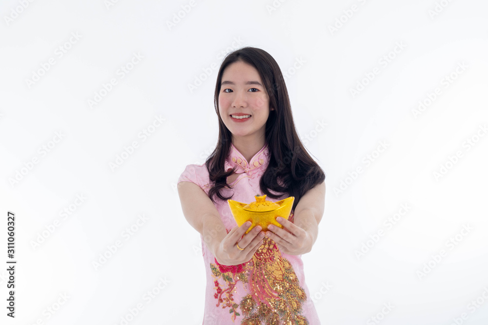 Chinese new year with Beauty smiling woman wears dresses traditional cheongsam and showing gold, studio shot isolated on white background. Chinese new year with Beauty smiling woman wears dresses traditional cheongsam and showing gold, studio shot isolated on white background.