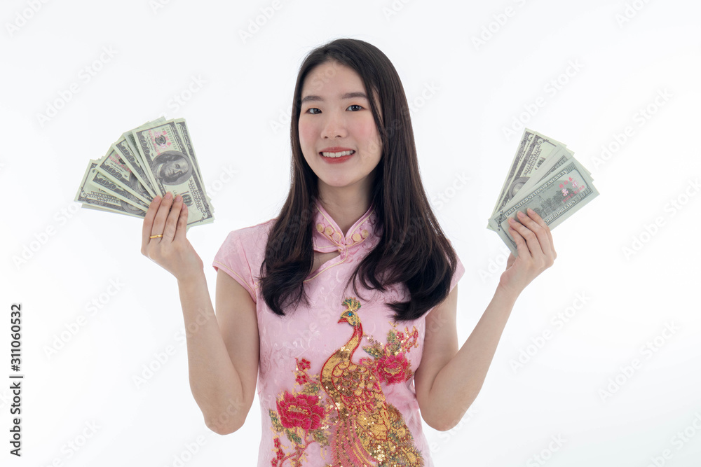 Chinese new year with Beauty smiling woman wears dresses traditional cheongsam and holds money, studio shot isolated on white background. Chinese new year with Beauty smiling woman wears dresses traditional cheongsam and holds money, studio shot isolated on white background.