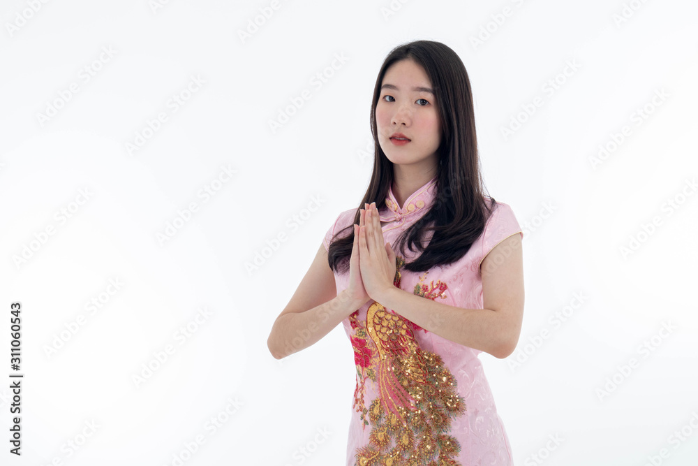 Chinese new year with Beauty smiling woman wears dresses traditional cheongsam, studio shot isolated on white background. Chinese new year with Beauty smiling woman wears dresses traditional cheongsam, studio shot isolated on white background.