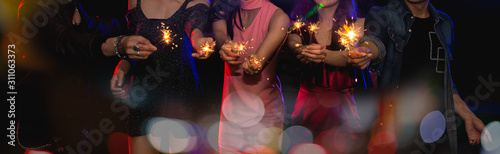 Photography Holiday celebrations with firework concept, Traveller people celebrating, dancing together with enjoying at colourful full moon party club
