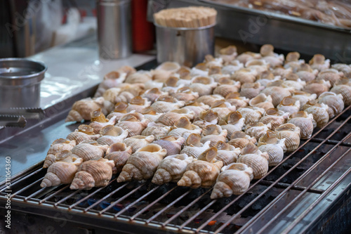 Selective focus of grilled sea snails,Taiwan street food.