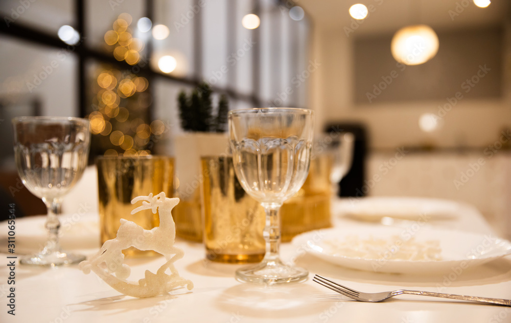 Close up photo of festive table setting in a restaurant or in a beautiful big house on some holidays.