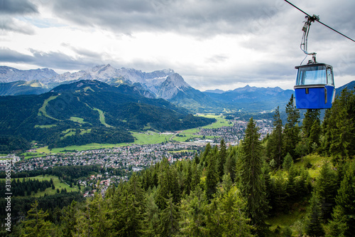 View of Garmisch-Partenkirchen in Bavaria Germany with cable car cabin and Zugspitze in the background
