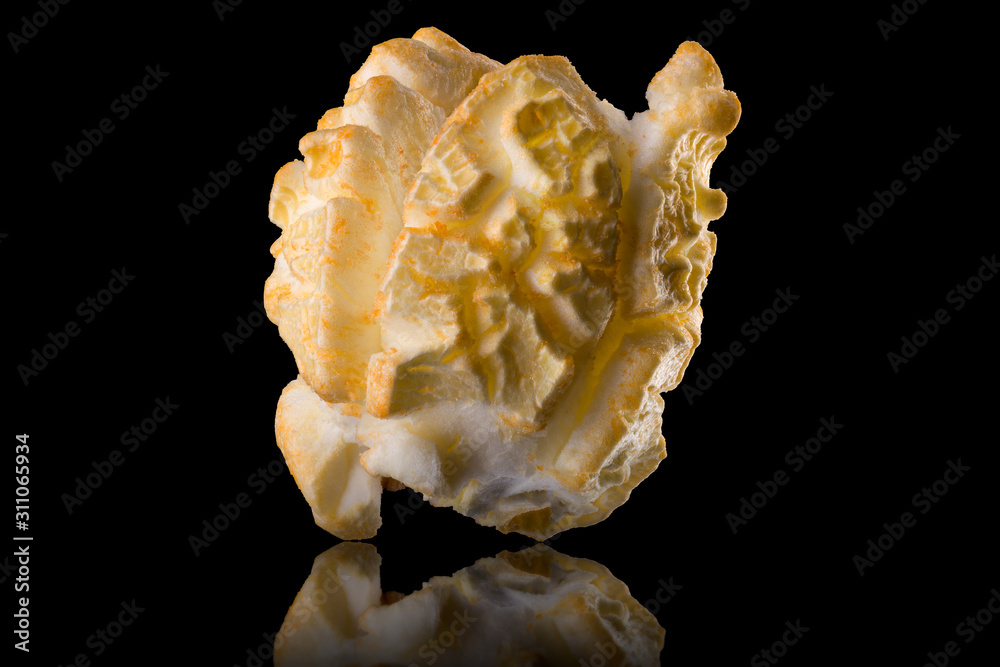 Single popped popcorn on a black backgroundwith clipping path Single popped popcorn on a black backgroundwith clipping path