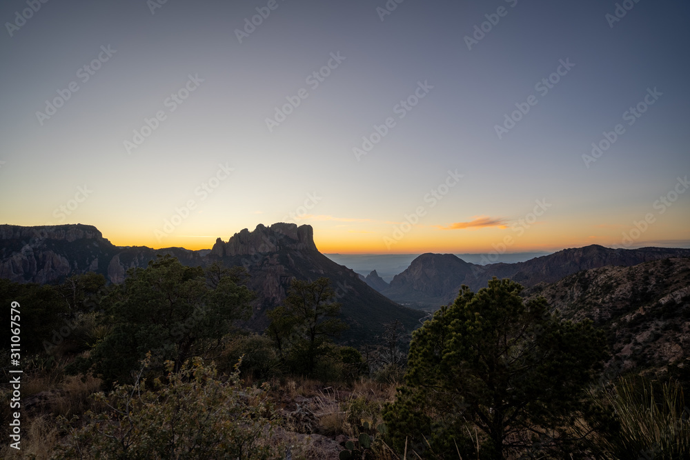 The sun begins to set over the mountains of West Texas. The sun begins to set over the mountains of West Texas.