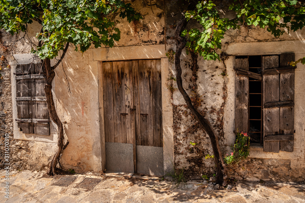 Arched door to the courtyard of the old house. Arched door to the courtyard of the old house.