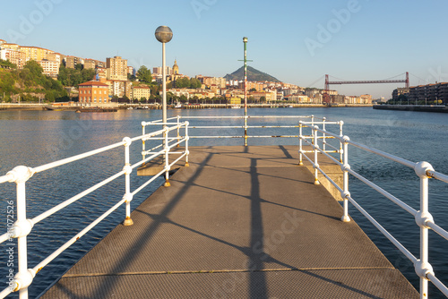 Portugalete and Getxo with Hanging Bridge of Bizkaia from La Benedicta pier, Basque Country, Spain photo