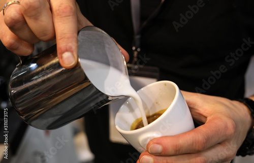  Barista making coffee at coffee machine