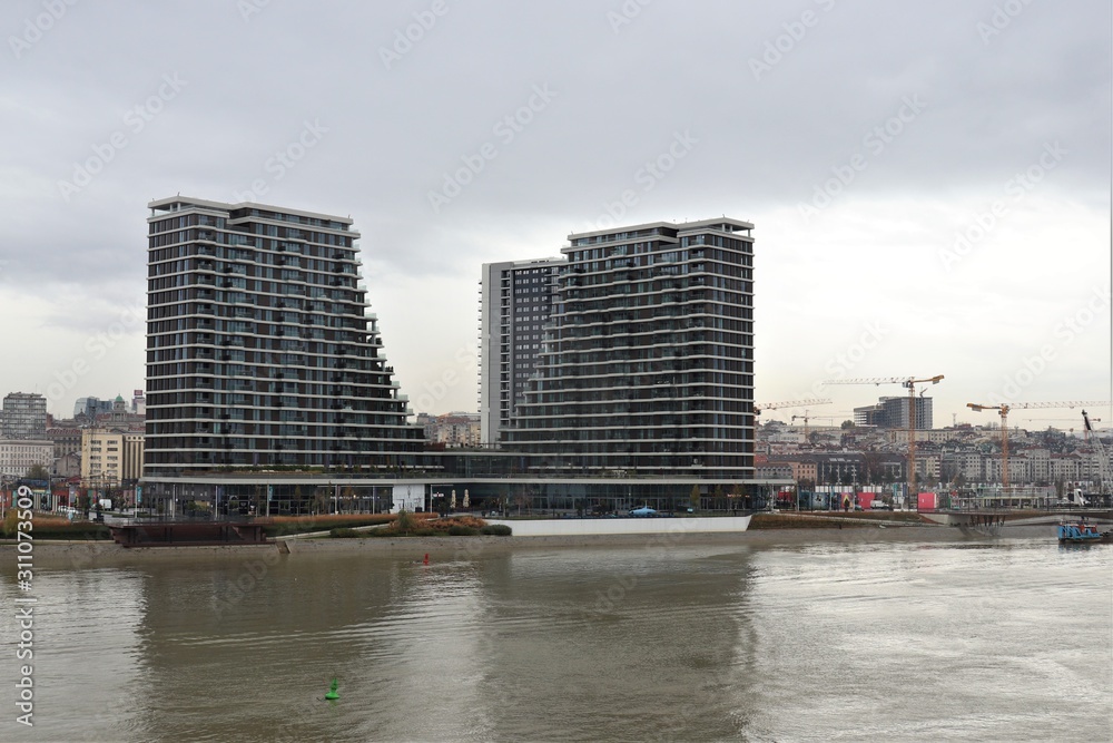 High-rise new buildings on the river bank.