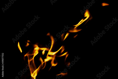 yellow fire on black background texture isolated