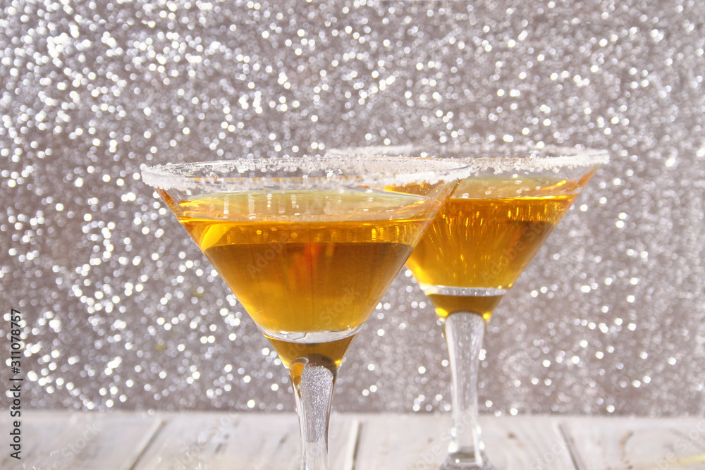 Two glasses with a yellow cocktail Two glasses with a yellow cocktail