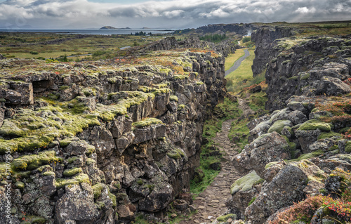 Þingvellir or Thingvellir national park in Iceland, is a site of historical, cultural, and geological significance, the fissure devides the tectonic plates of America and Eurasia photo