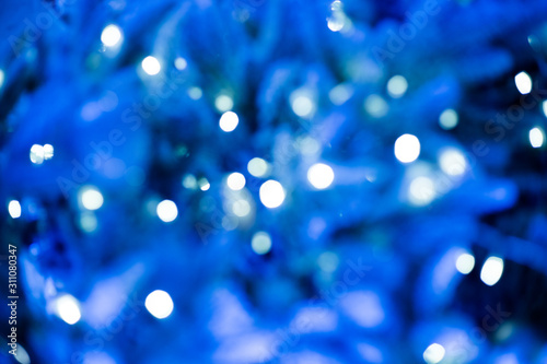 Image of blurred bokeh background with blue colorful lights, Color of the year.