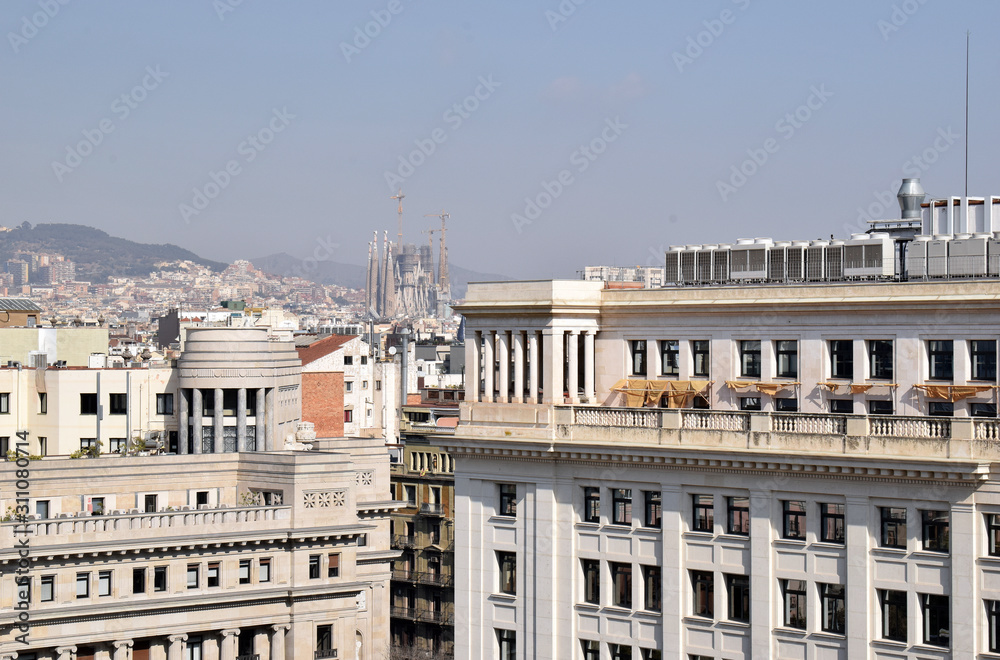 Rooftop View Across Sunny Spanish City with Decorative Buildings 