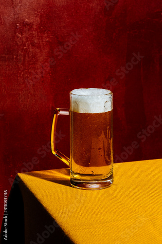 Blonde beer mug, Ale or Lager. Colorful background photo