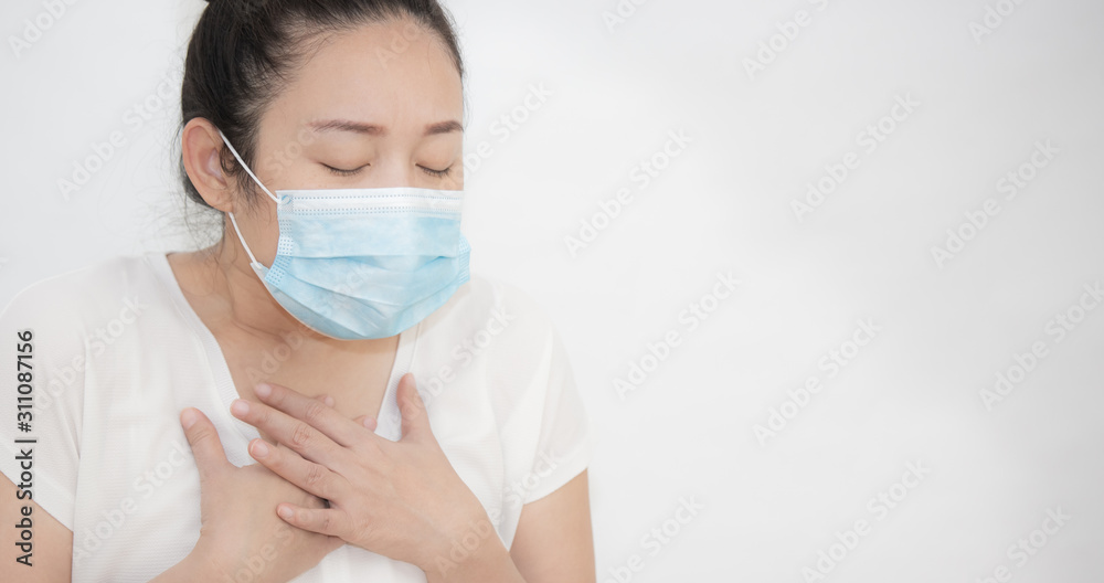 The image of a young Asian woman wearing a mask to prevent germs, toxic fumes, and dust. Prevention of bacterial infection in the air in a white background The image of a young Asian woman wearing a mask to prevent germs, toxic fumes, and dust. Prevention of bacterial infection in the air in a white background