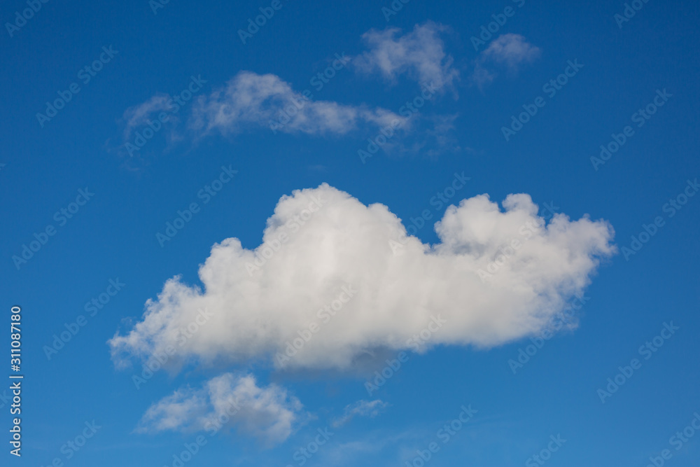 A view of the clear blue sky and white clouds on a clear day. A view of the clear blue sky and white clouds on a clear day.