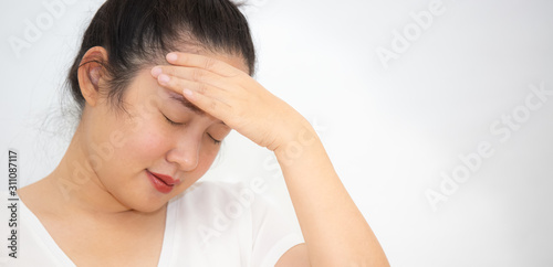 Picture of a girl with severe headache The handle on her head  health problems  stress  medical conditions or rest  a rest in a white background