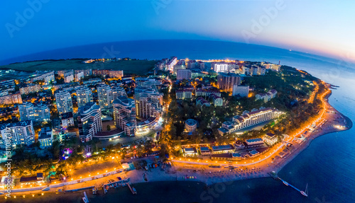 Evening panorama of the seaside resort of Gelendzhik. View of the Thick Cape and lighthouse. See the beach and the promenade, large residential complex