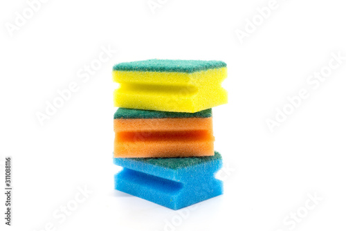 Three multi-colored sponges for washing dishes on a white background